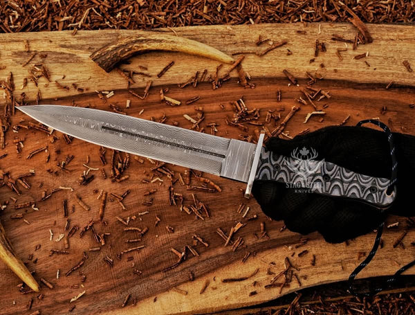 Full view big dagger knife with black Micarta handle and sheath