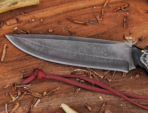 D2 hunting knife handle with intricate wolf design