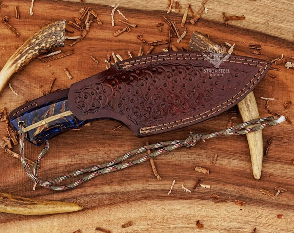 D2 skinning knife with pinecone handle and classic leather sheath