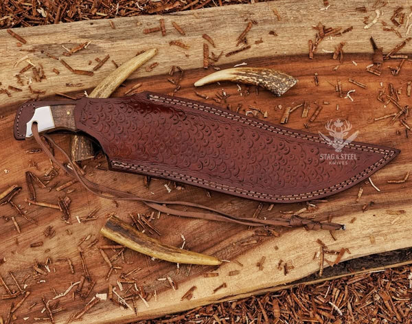 Damascus steel Bowie knife with walnut wood handle and leather sheath