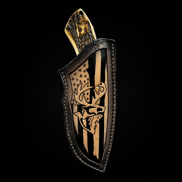 A custom leather knife sheath with a carved deer head and American flag design, holding a knife with a bone handle, set against a solid black background.