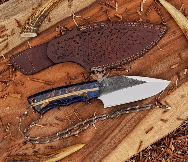 Handmade D2 skinning knife paired with traditional leather sheath