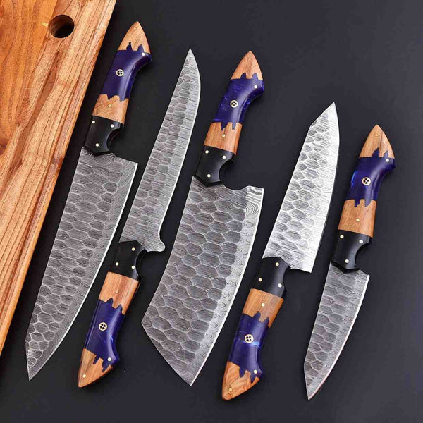 Damascus kitchen knife set with purple resin and ash wood handles