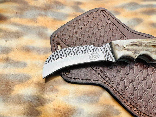Retained rasp teeth crosshatch along the spine of a handmade hawkbill blade