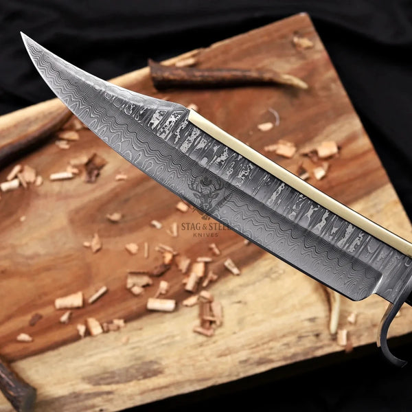 alamo musso damascus bowie knife rosewood handle blade close up damascus pattern and bevel detail