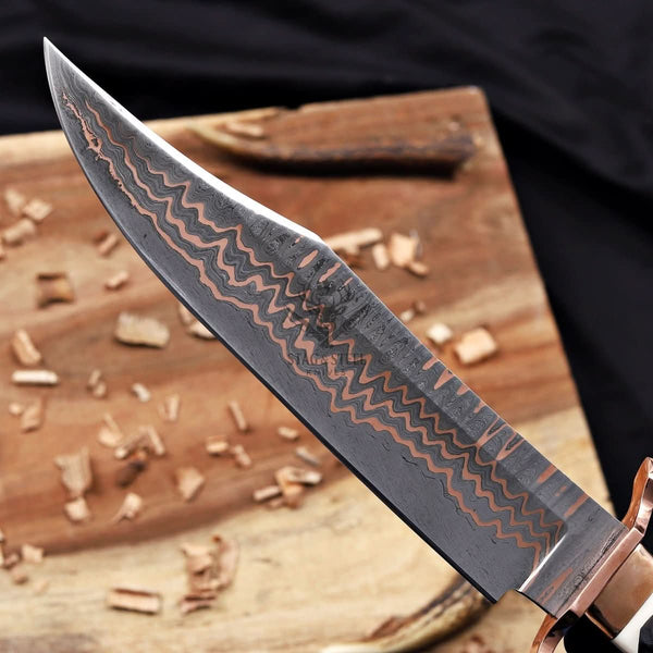 Copper Damascus bowie knife blade closeup