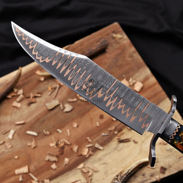 copper Damascus blade pattern close up on Bowie knife