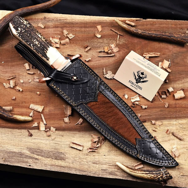 Copper Damascus bowie knife inside leather sheath carry view