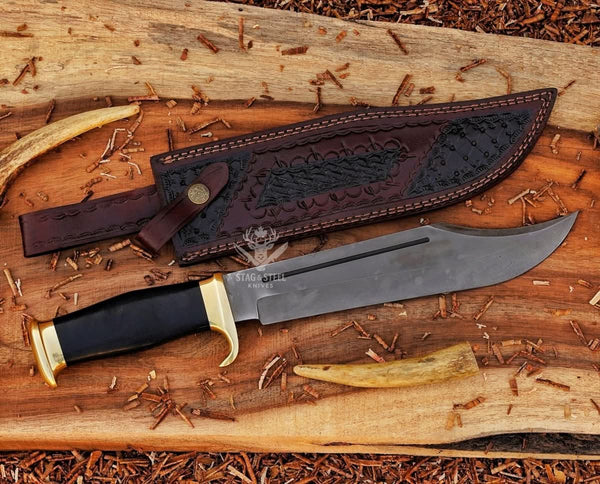 Large survival Bowie knife with polished D2 blade and black micarta grip and leather sheath