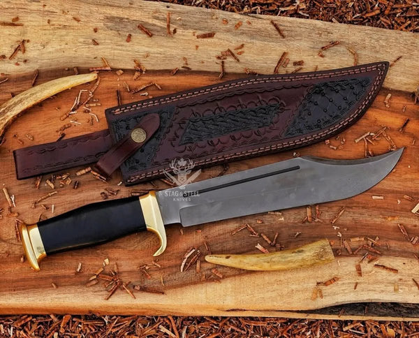 Large survival Bowie knife with polished D2 blade and black micarta grip and leather sheath