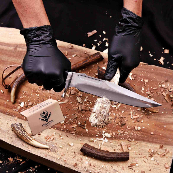 5mm thick D2 bowie blade shown in action cutting firewood