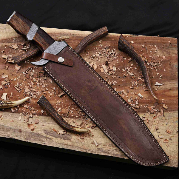 Handmade Damascus bowie knife with hand-stitched cowhide leather sheath