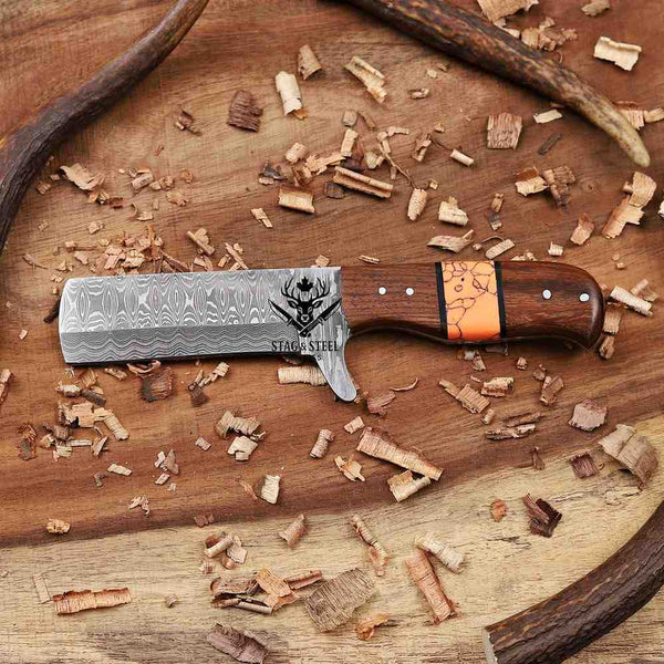 Wooden knife with decorative blade on a wooden surface with wood shavings