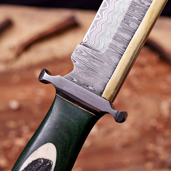 Forged Damascus guard and brass spine on handmade toothpick bowie knife