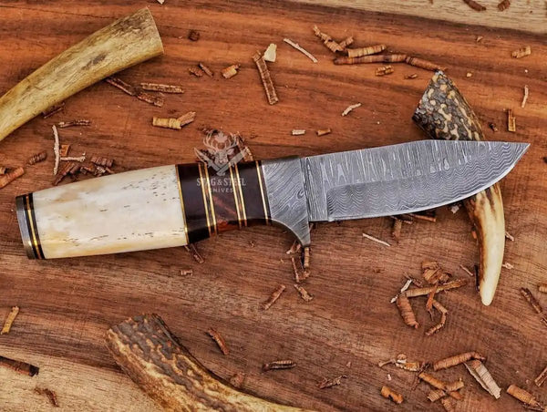 Damascus hunting knife used for camping and hunting