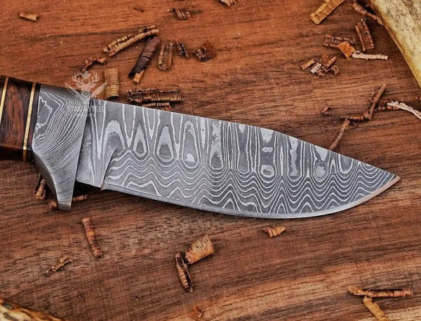 Close-up of Damascus steel blade pattern on hunting knife