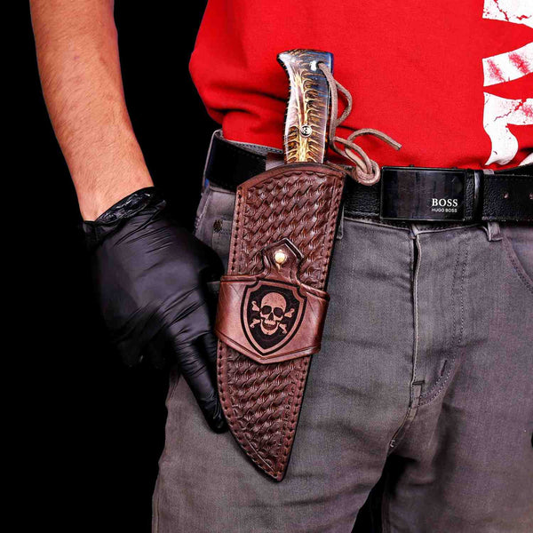 San Mai Damascus hunting knife worn on belt in vertical carry leather sheath