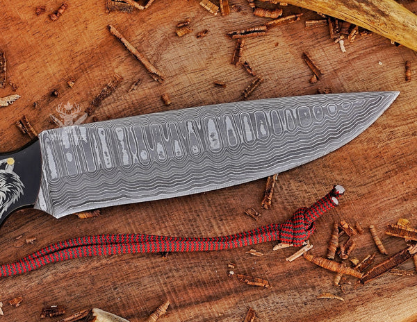 Handmade damascus hunter knife showing blade pattern detail