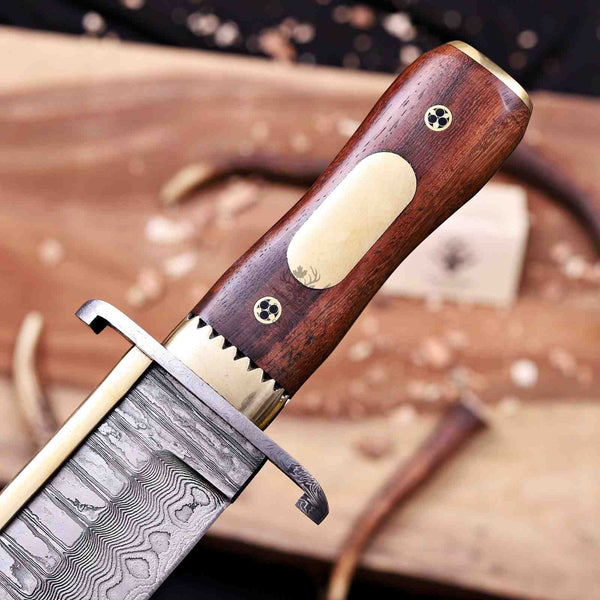 Rosewood grip with brass engraving inlay and mosaic pins on Iron Mistress bowie knife