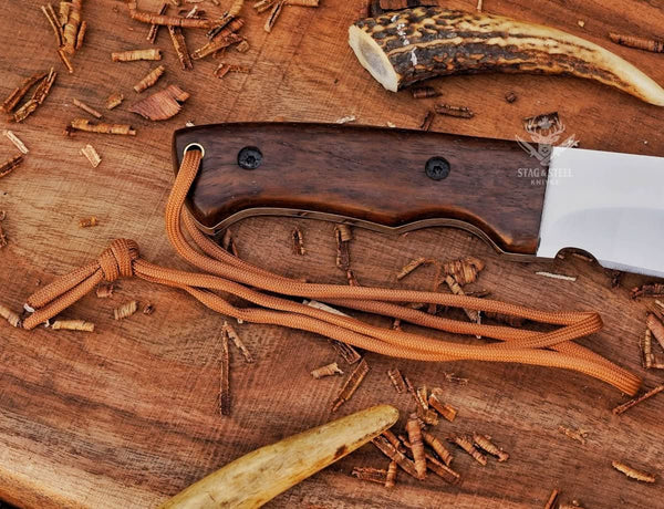 Close-up of Ironwood handle on full tang D2 machete knife with handle pins and lanyard hole