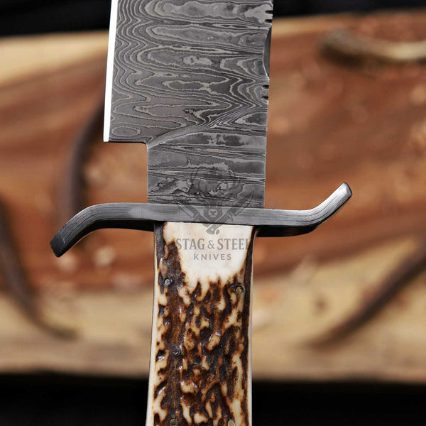 Close-up of the Damascus guard, antler handle and Ladour-pattern Bowie blade