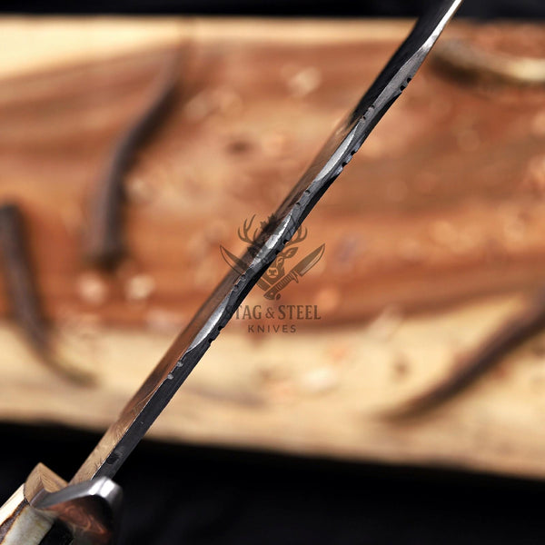 Edge-on view of the Juan Padillo Damascus Bowie blade and hand-filed spine