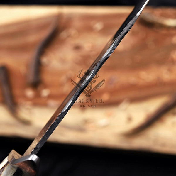 Edge-on view of the Juan Padillo Damascus Bowie blade and hand-filed spine