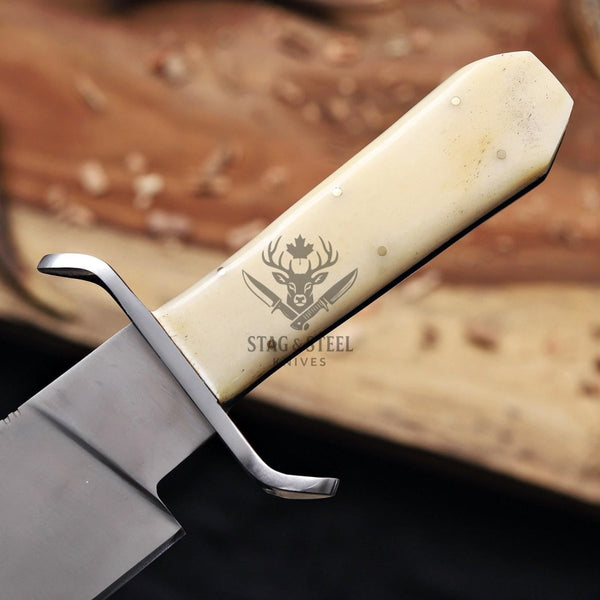 Close-up of the camel bone handle with steel guard and brass pins