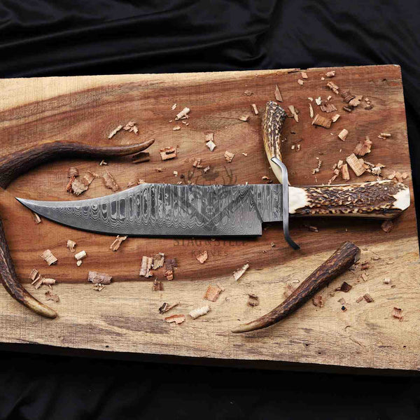Full-length Juan Padillo Damascus Bowie knife with antler handle and clip-point Damascus blade