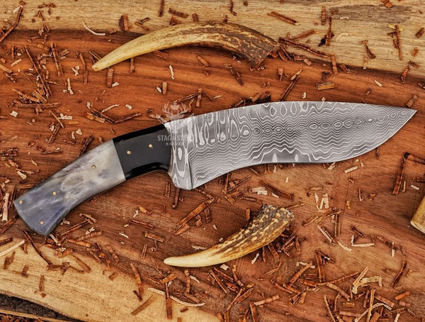 Side profile of Damascus Kukri Bowie knife with curved kukri blade