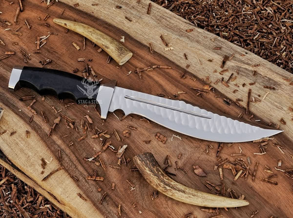large bowie knife with black micarta handle