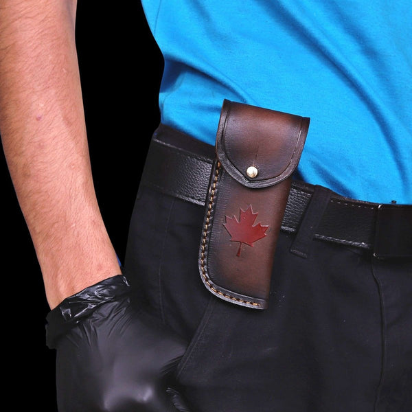 Italian leather maple leaf sheath attached to belt for folding knife carry