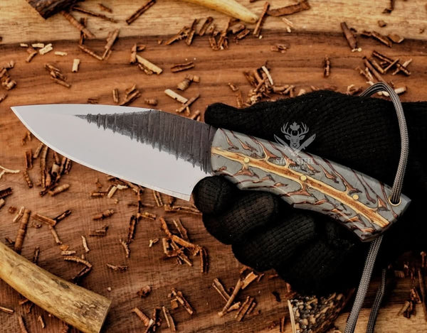 Best skinning knife showcasing sharp D2 blade and natural pinecone handle