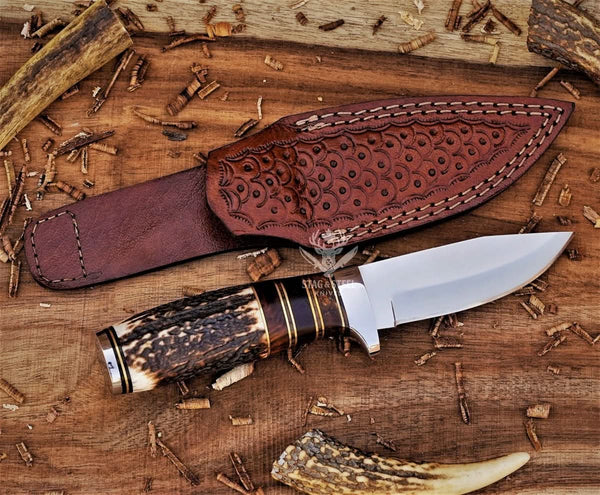 Small hunting knife with D2 steel blade and stag horn handle with leather sheath