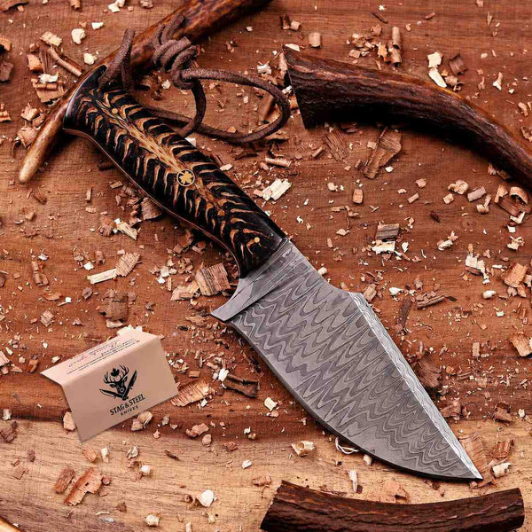 Close-up of stainless Damascus blade pattern on handmade hunting knife