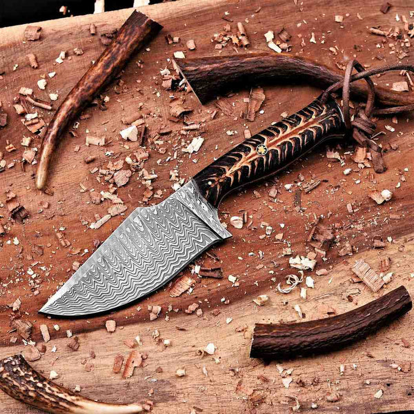 Handmade stainless Damascus hunting knife with black pine cone handle