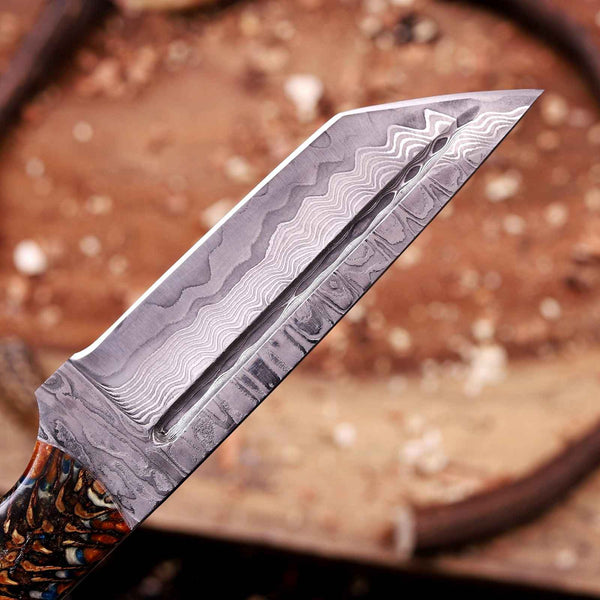 Close-up of reinforced tanto point on San Mai Damascus blade