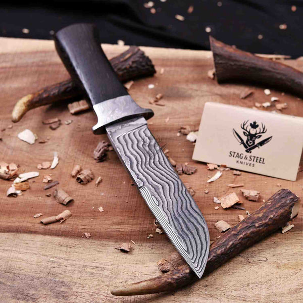 Layered VG10 15N20 Damascus pattern close-up on hunting knife blade