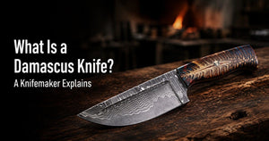 Hand-forged Damascus knife showing the layered steel pattern