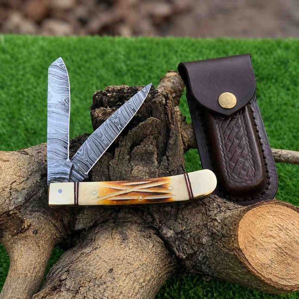Damascus trapper knife with camel bone handle 
