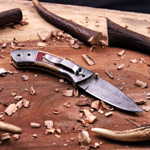 Damascus pocket knife with stainless steel pocket clip and handmade folding design