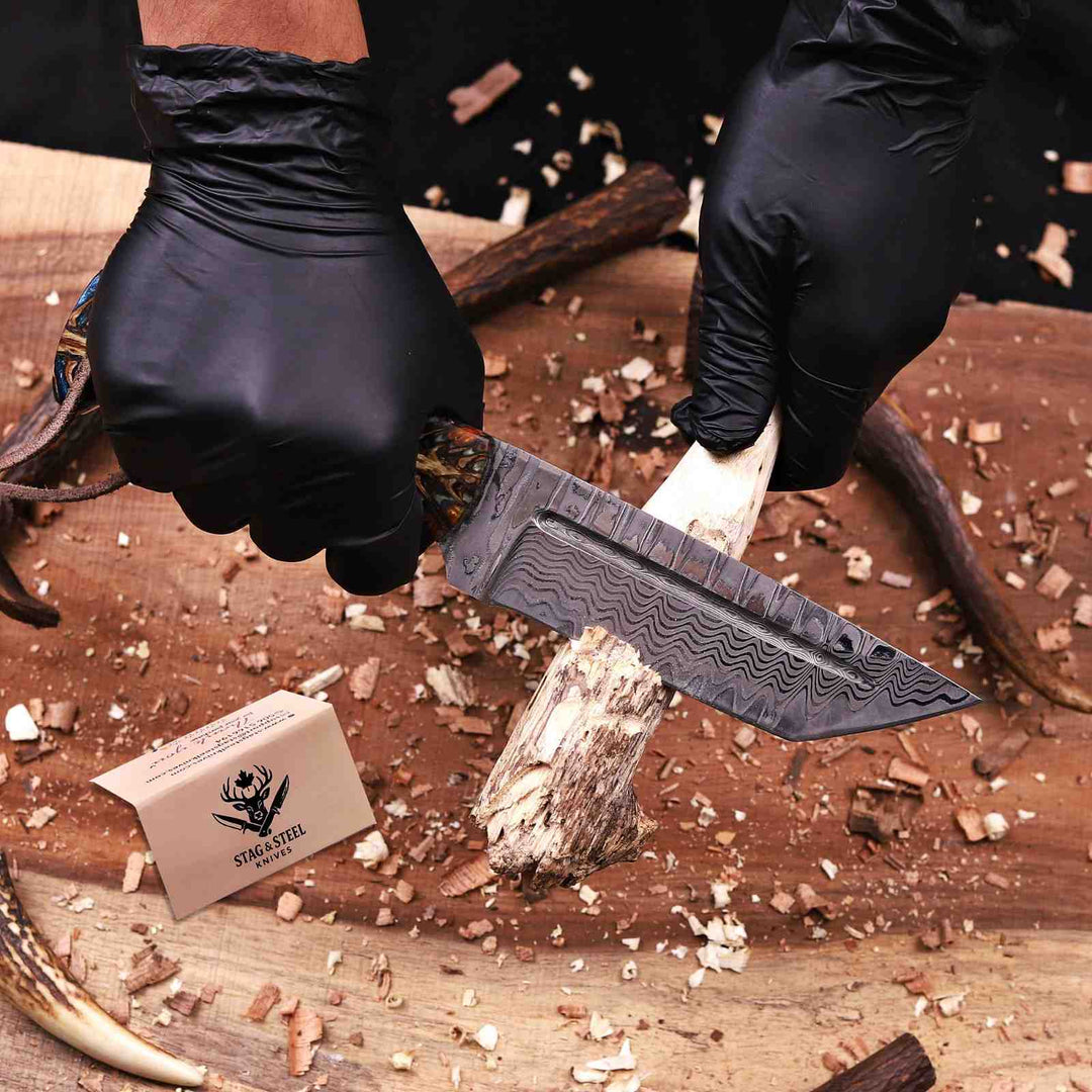 Damascus tanto knife cutting wood showing tip strength