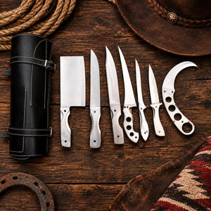 Six-piece one-piece steel knife set with skeletonized handles beside a leather roll