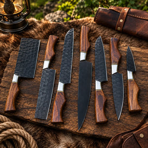 Seven-piece black blade kitchen knife set with hardwood handles and steel bolsters