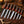 7-piece Japanese kitchen knife set with patterned blades and dark wooden handles featuring red accents displayed on a rustic wooden board