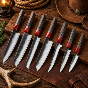 7-piece Japanese kitchen knife set with patterned blades and dark wooden handles featuring red accents displayed on a rustic wooden board