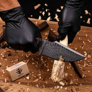 Stainless Damascus hunting knife cutting wood showing working edge