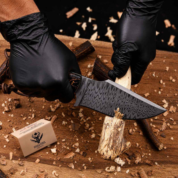 Stainless Damascus hunting knife cutting wood showing working edge