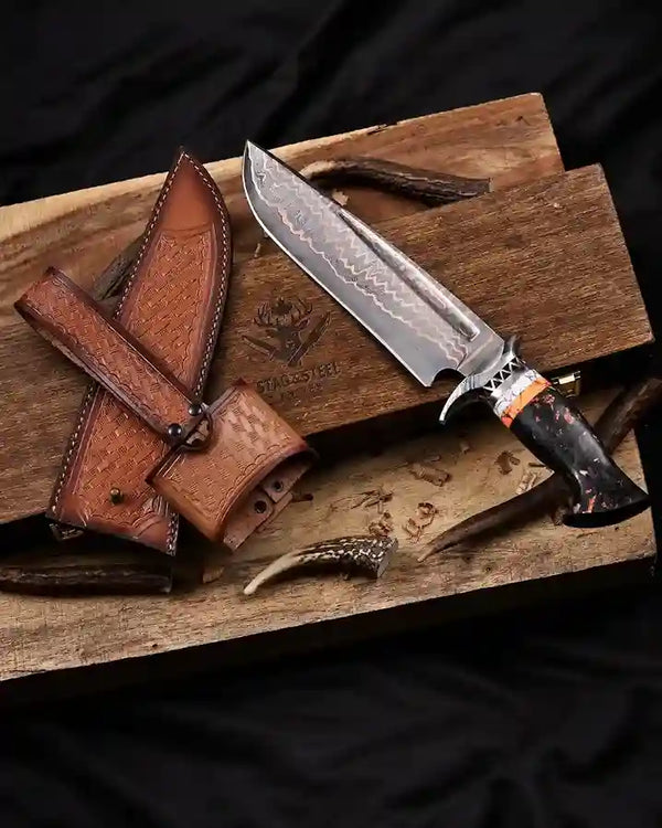 Copper Damascus bowie knife with a sheath in a wooden box on a dark background with leather sheath 