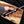 Close up of copper damascus bowie knife tang and guard.
